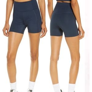 girlfriend collective // high-rise run short (color: midnight)